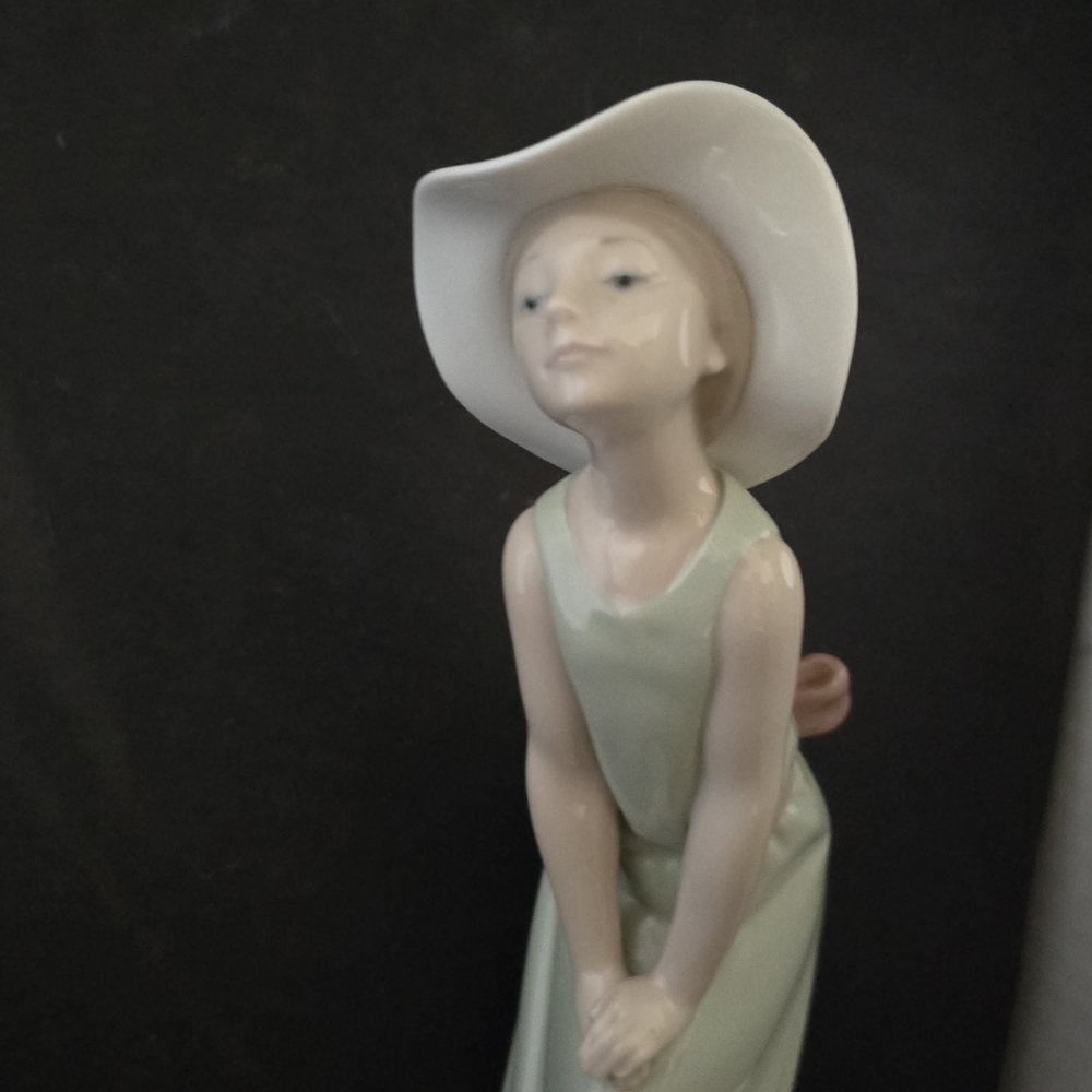 Lladro Porcelain Figurine with White Hat and Green Dress